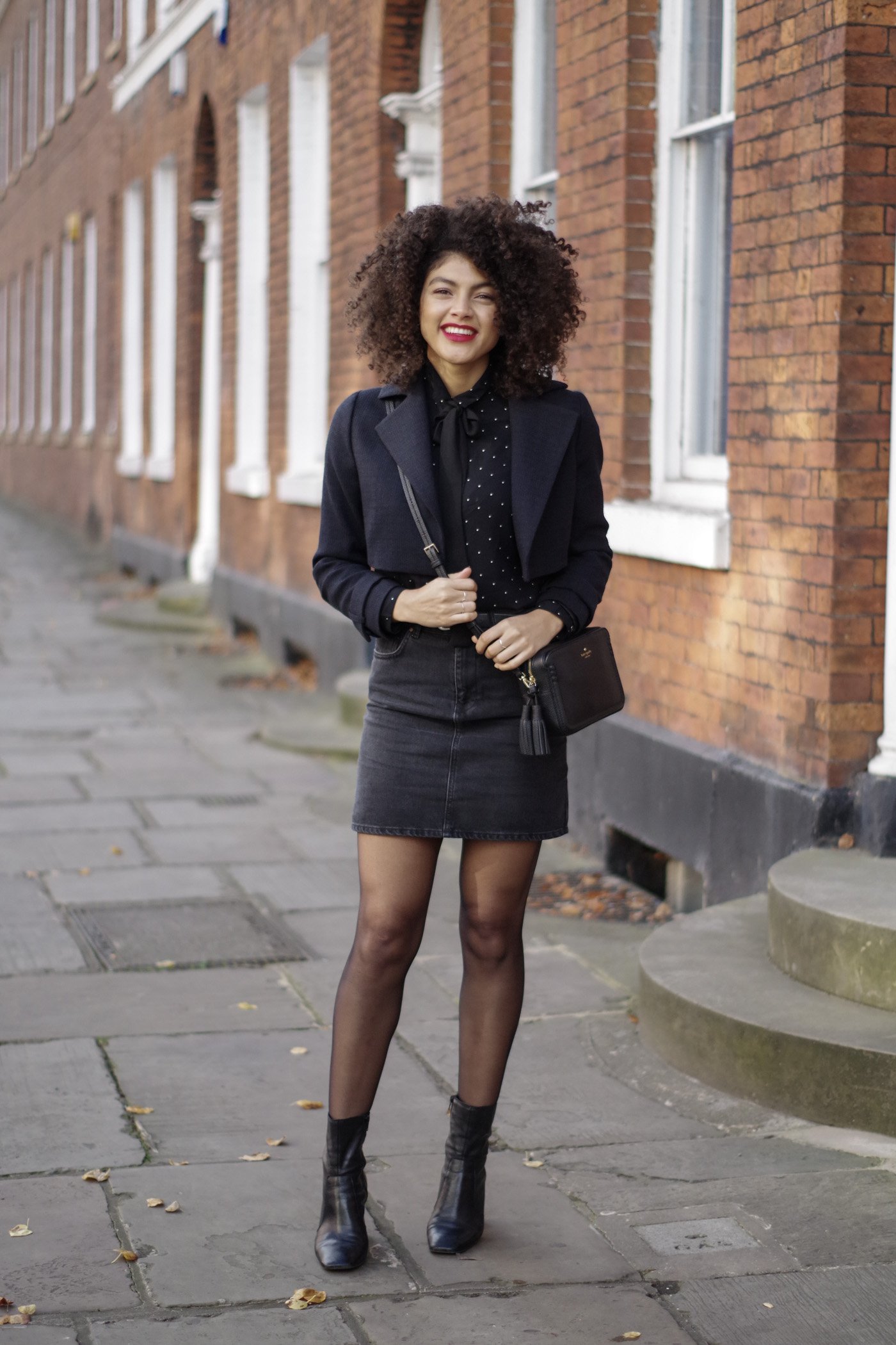 black denim asos skirt ankle boots kate spade cross body bad and cropped navy jacket outfit